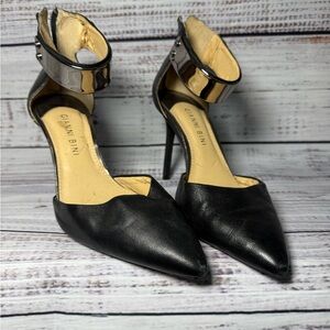 Silver and black pointed toe heels